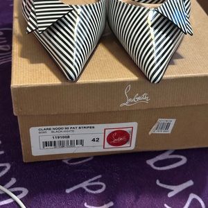 These are black and white striped slingback Christian Louboutin. Size 12